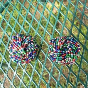 Knotted beaded clip on earrings